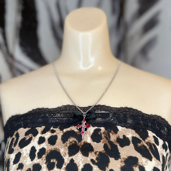 Cross Pendant Embellished W/ Red Stones and a Black Bow Accent on a Nice Silver-Toned Chain necklace